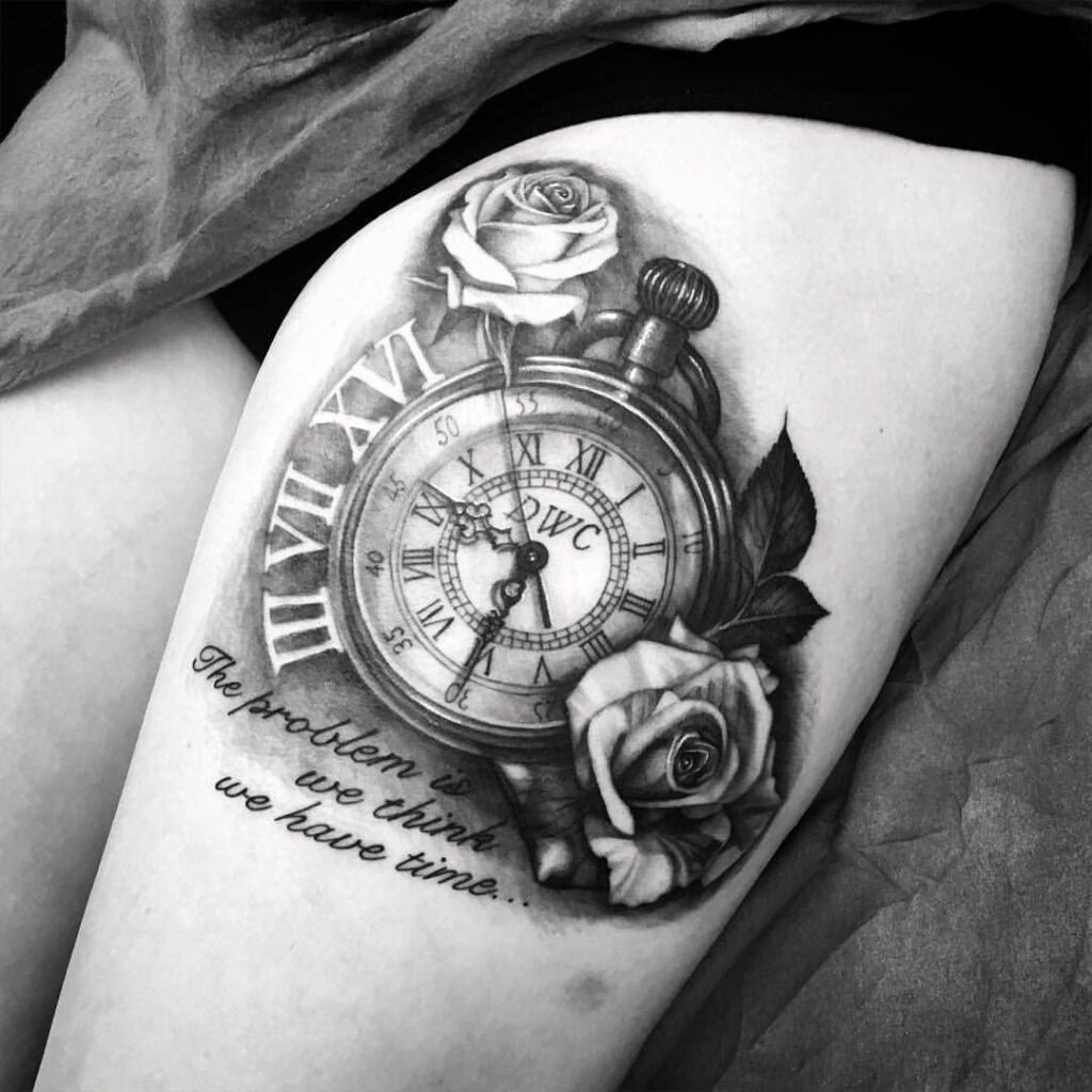 Large rose and clock tattoo on the thigh for women