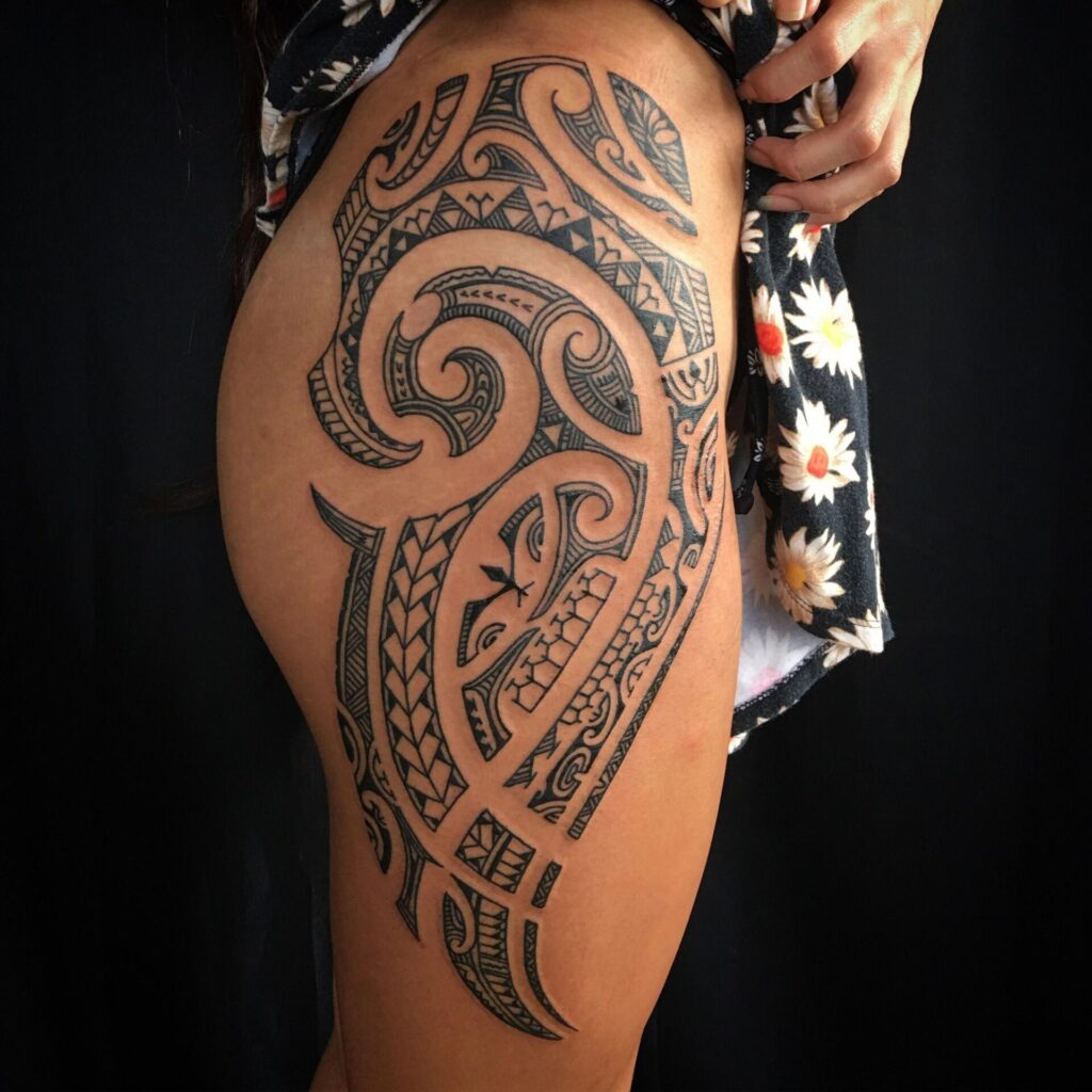 Large tattoo on the thigh for women