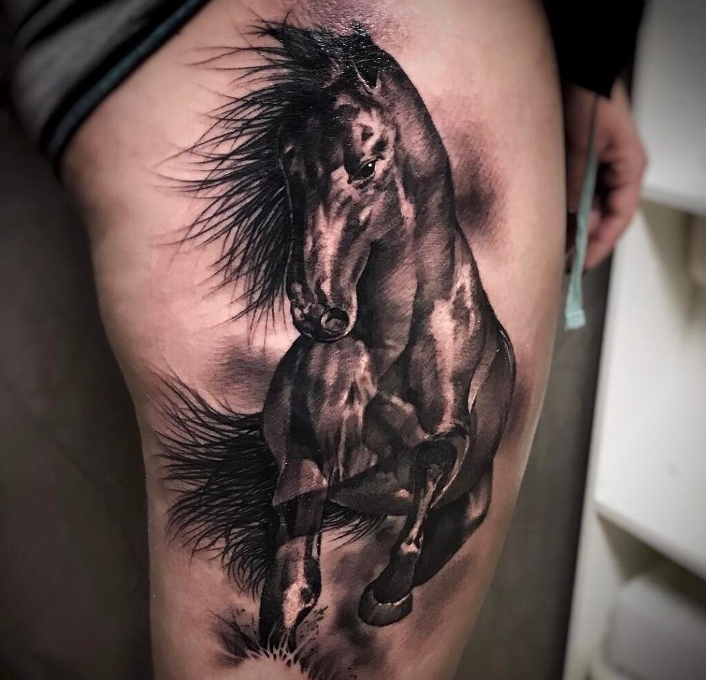 Large horse tattoo on the hip for men