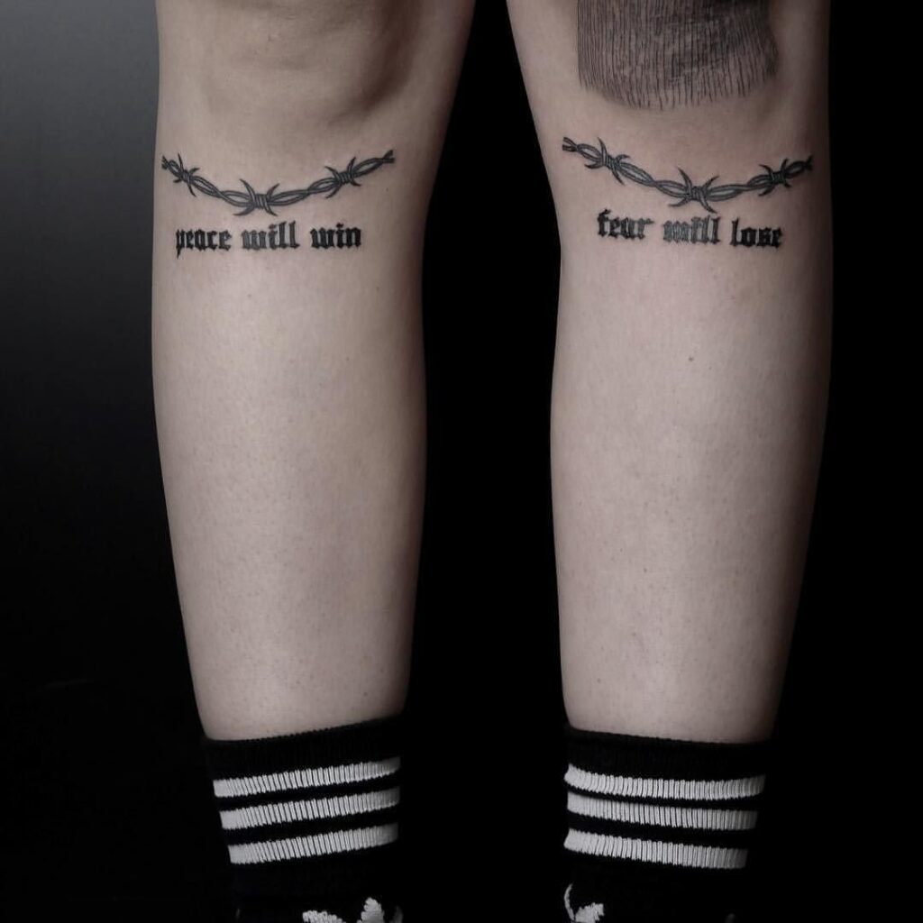 Tattoo with an inscription on the knee for women