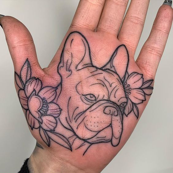 Pug tattoo on the palm of the hand for women