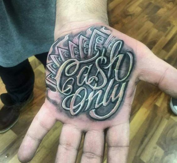 Tattoo with an inscription on the palm for men