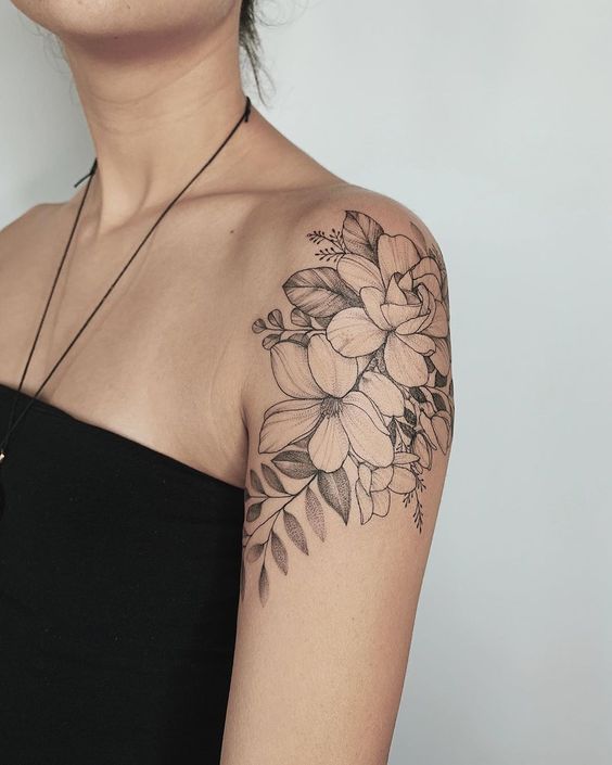 Flower tattoo on the shoulder for women