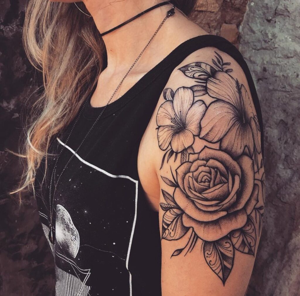 Flower tattoo on the shoulder for women