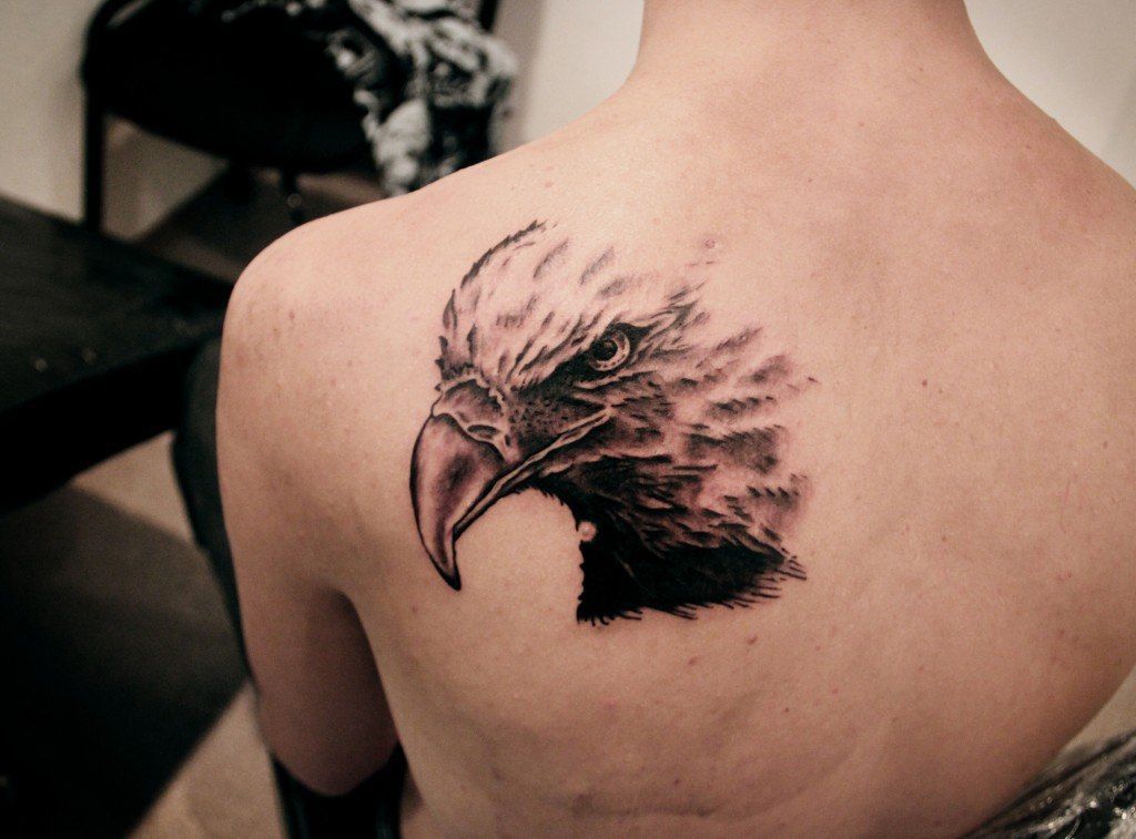 Large tattoo on the shoulder blade for men