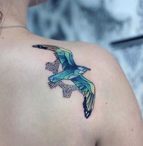 Bird tattoo on the shoulder blade for men