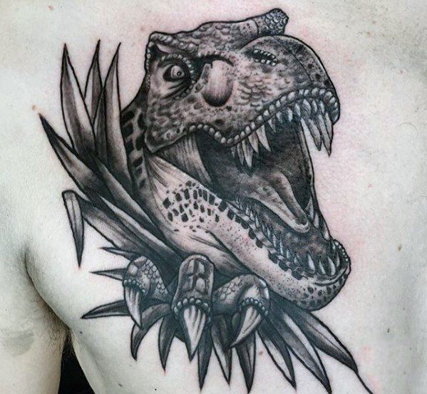 Large dinosaur tattoo on the shoulder blade for men