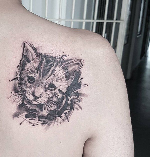 Cat tattoo on the shoulder blade for men