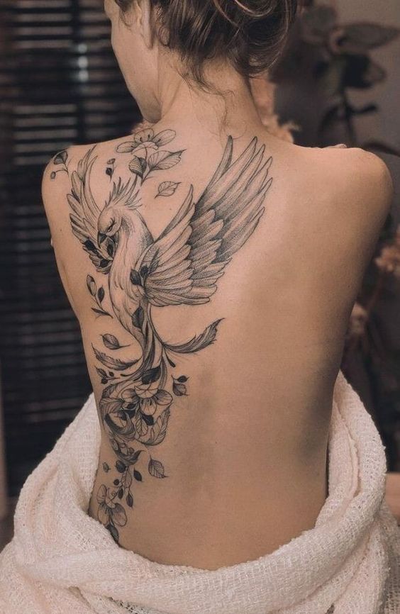 Large firebird tattoo on the shoulder blade for women