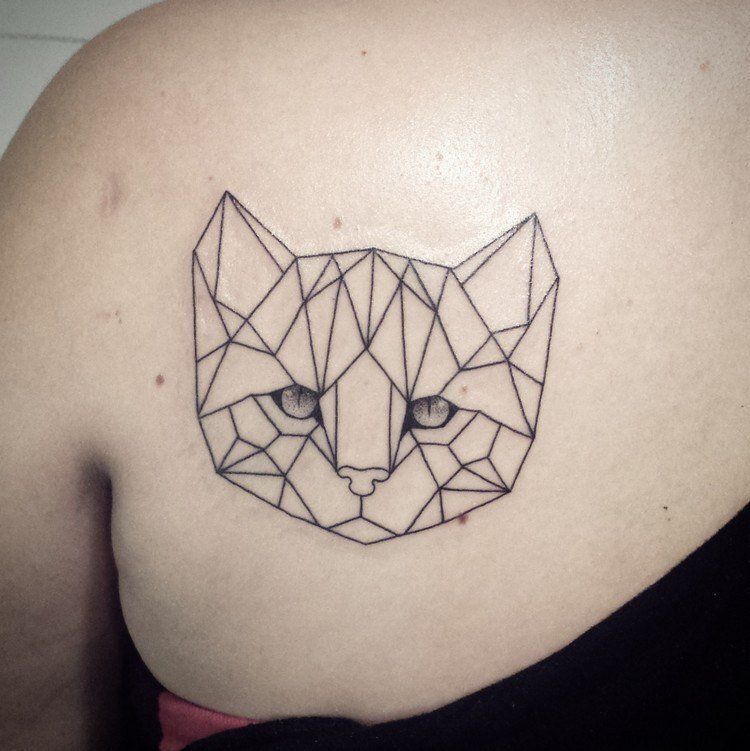 Cat tattoo on the shoulder blade for women