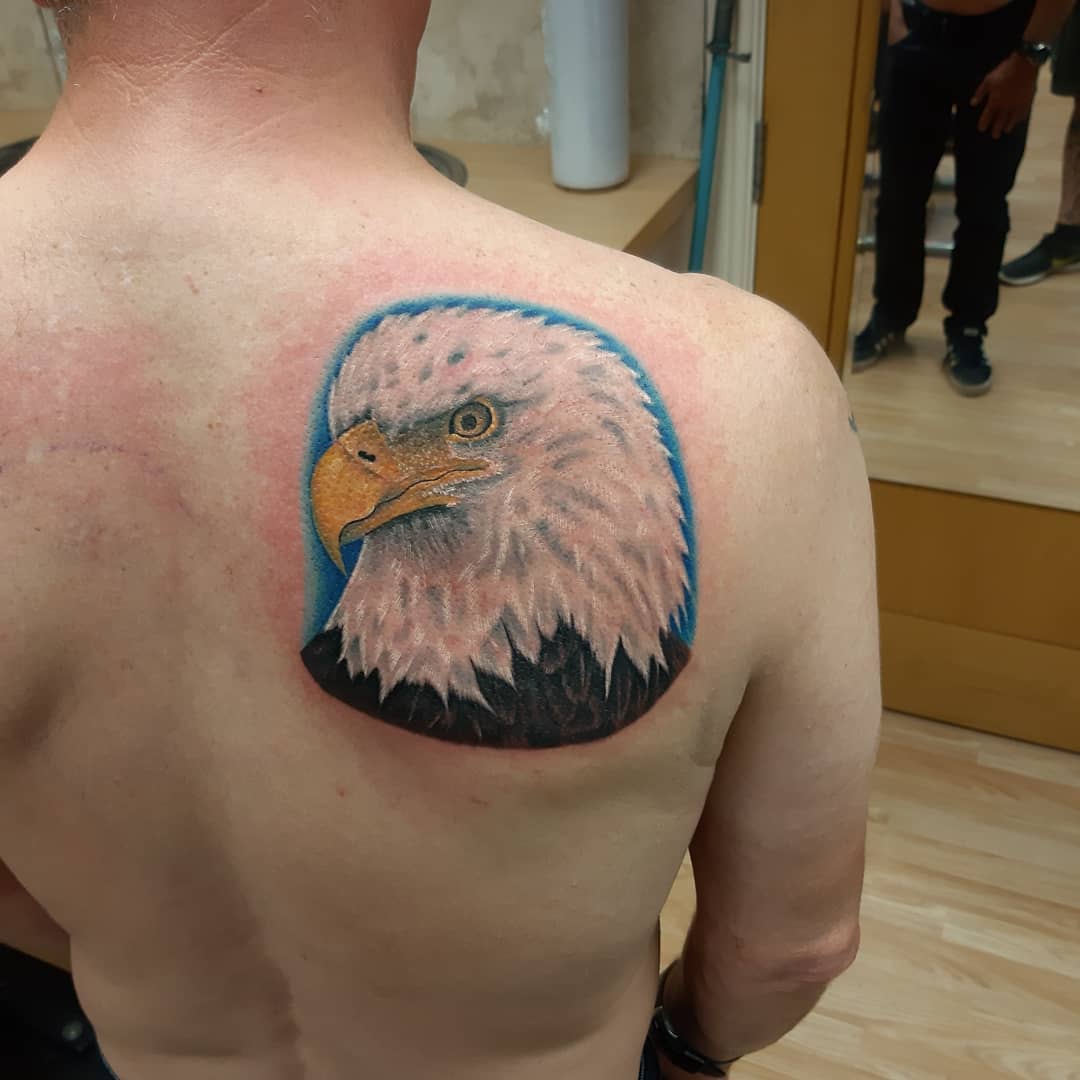 Eagle tattoo on the shoulder blade for women