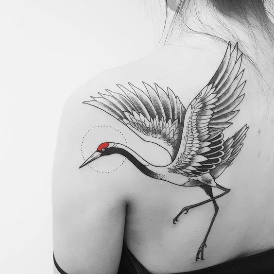 Crane tattoo on the shoulder blade for women