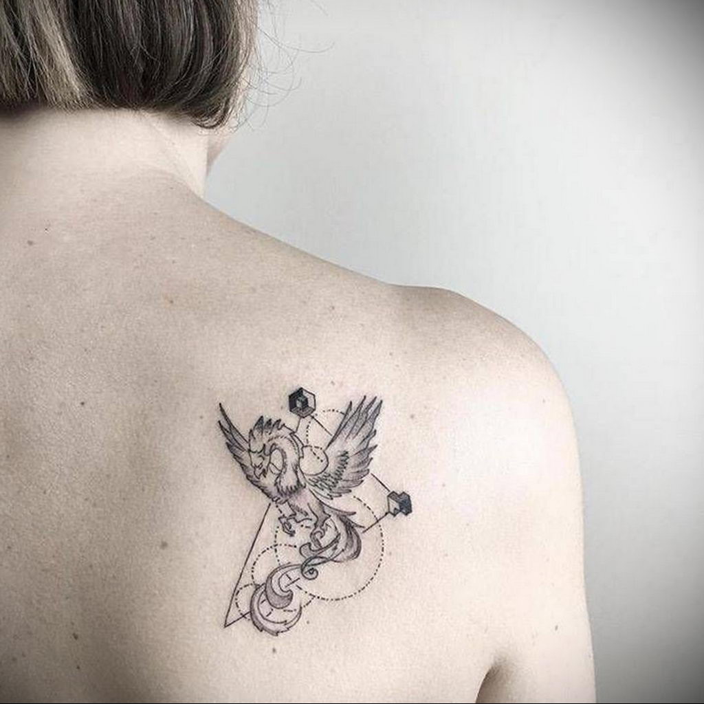 Firebird tattoo on the shoulder blade for women