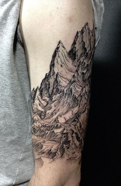 Tattoo of mountains on the shoulder for men