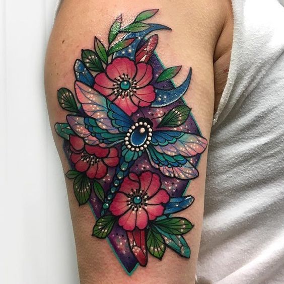 Colorful tattoo of flowers and dragonflies on the shoulder for men