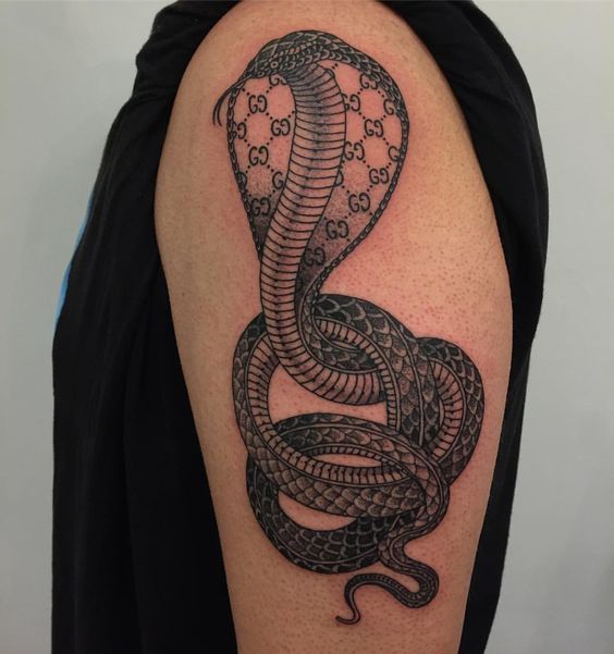 Large cobra tattoo on the shoulder for men