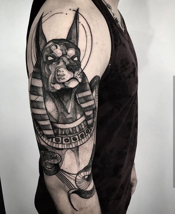 Anubis tattoo on the shoulder for men