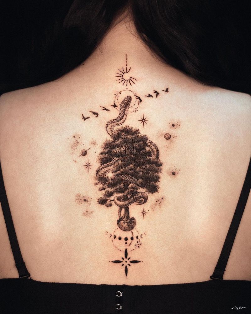 Tree and snake tattoo on the spine for women