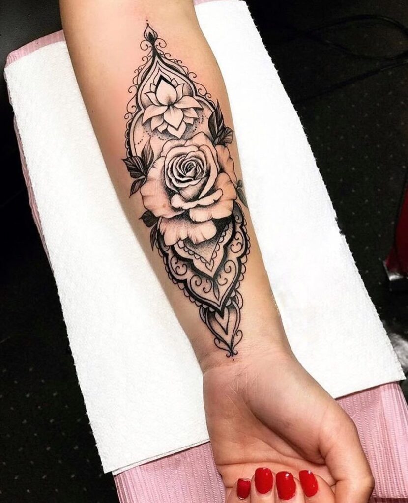 Rose tattoo on the arm for women