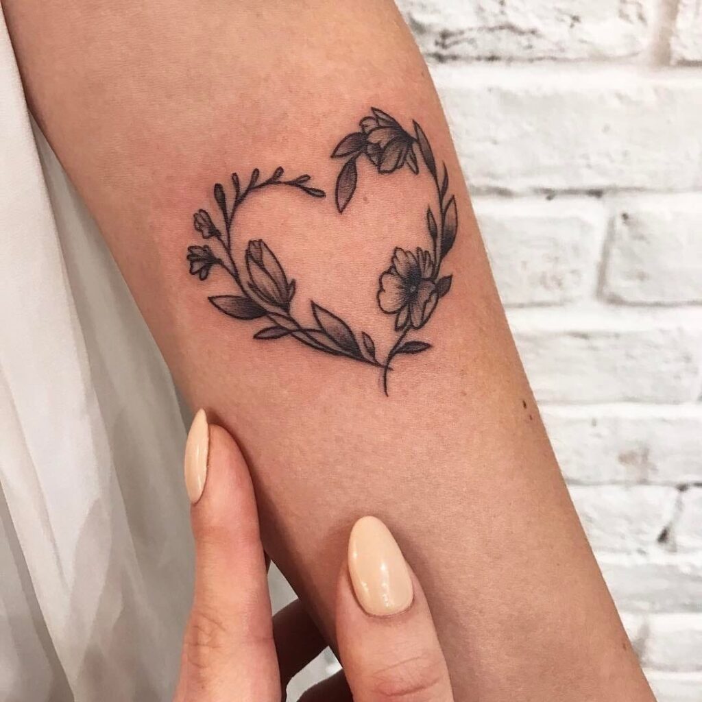 Heart tattoo on the arm for women