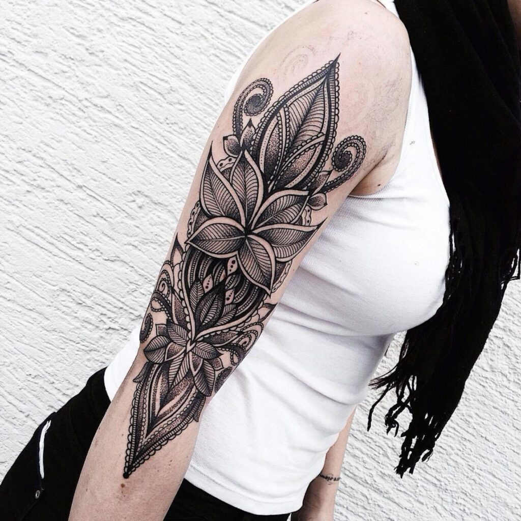 Large tattoo on the arm for women