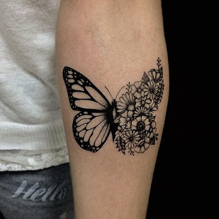 Butterfly tattoo on the arm for women