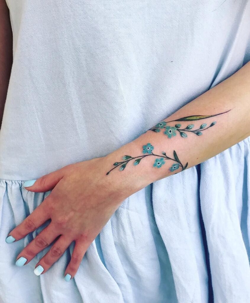 Color tattoo on the arm for women