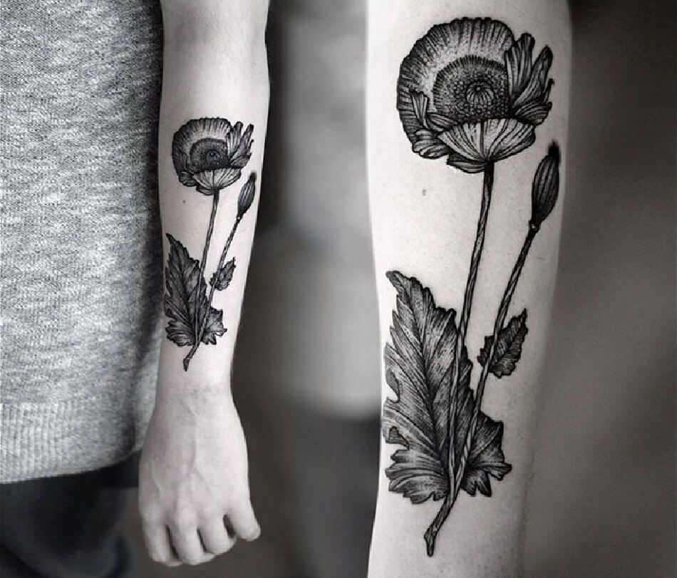 Large poppy tattoo on the arm for women