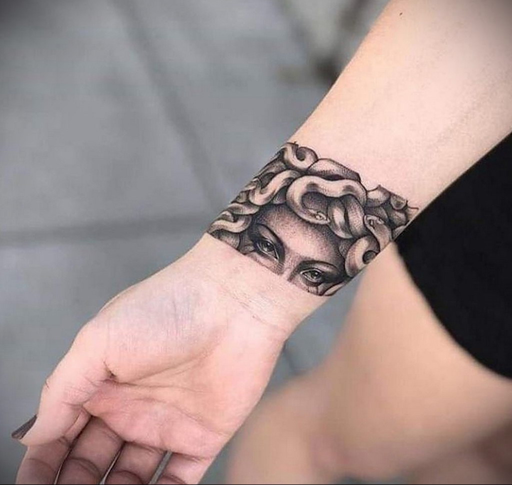 Medusa gorgon tattoo on the arm for women