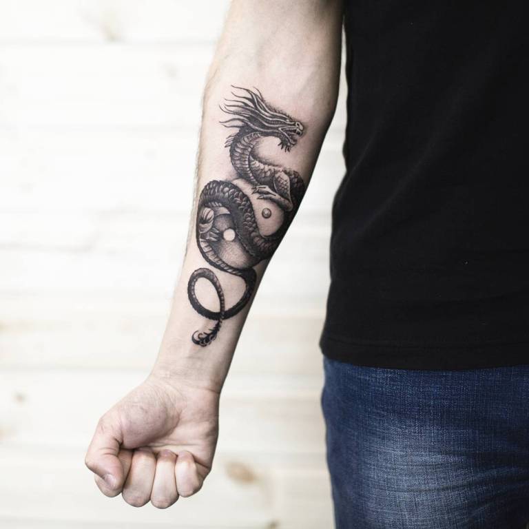 Dragon tattoo on the arm for men