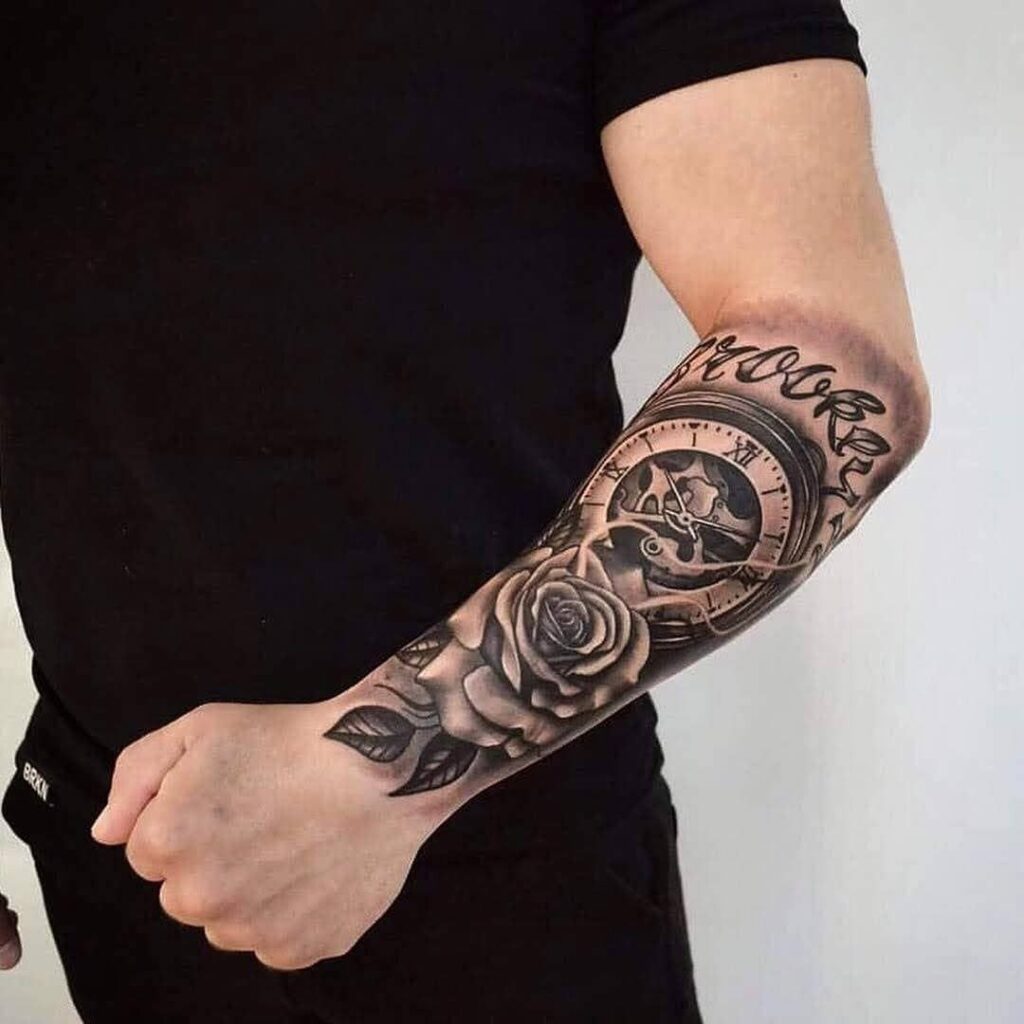 Tattoo of a rose and compass on the arm for men