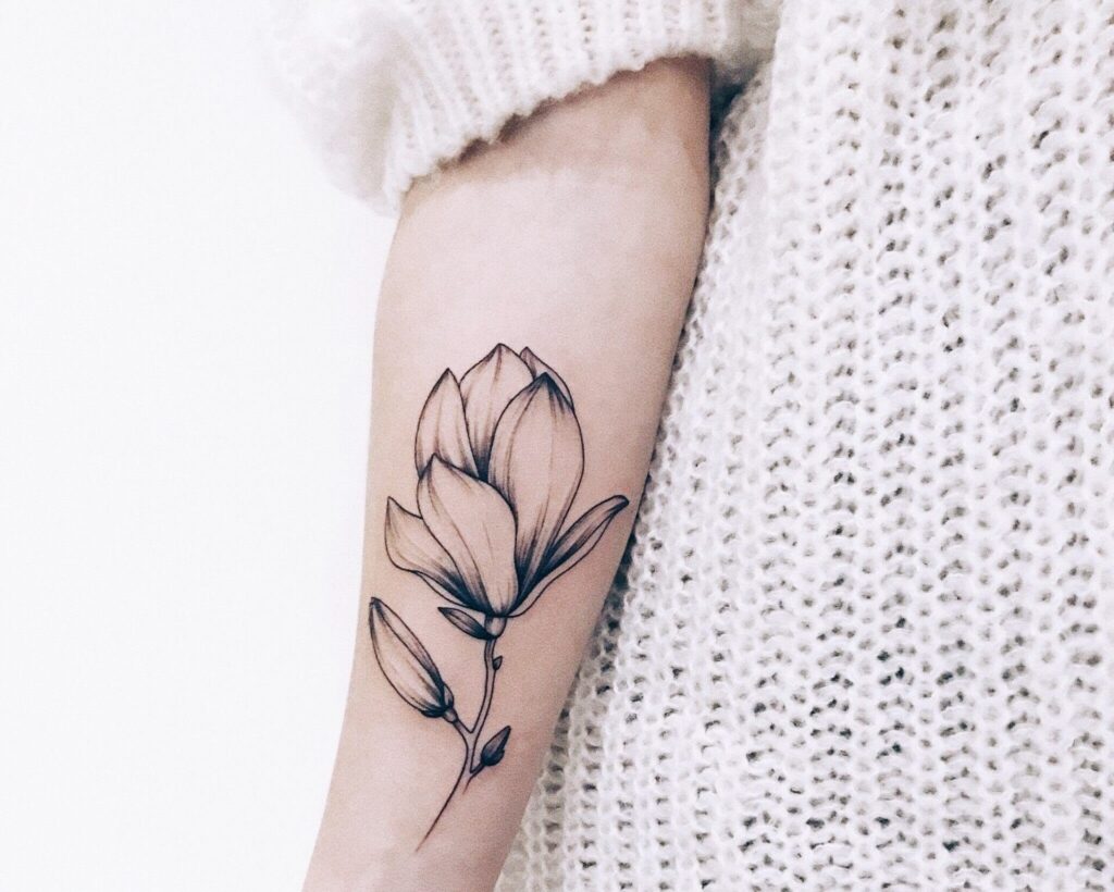 Flower tattoo on the arm for women