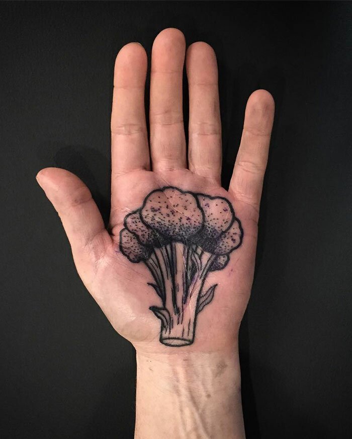 Large broccoli tattoo on the palm of the hand for men