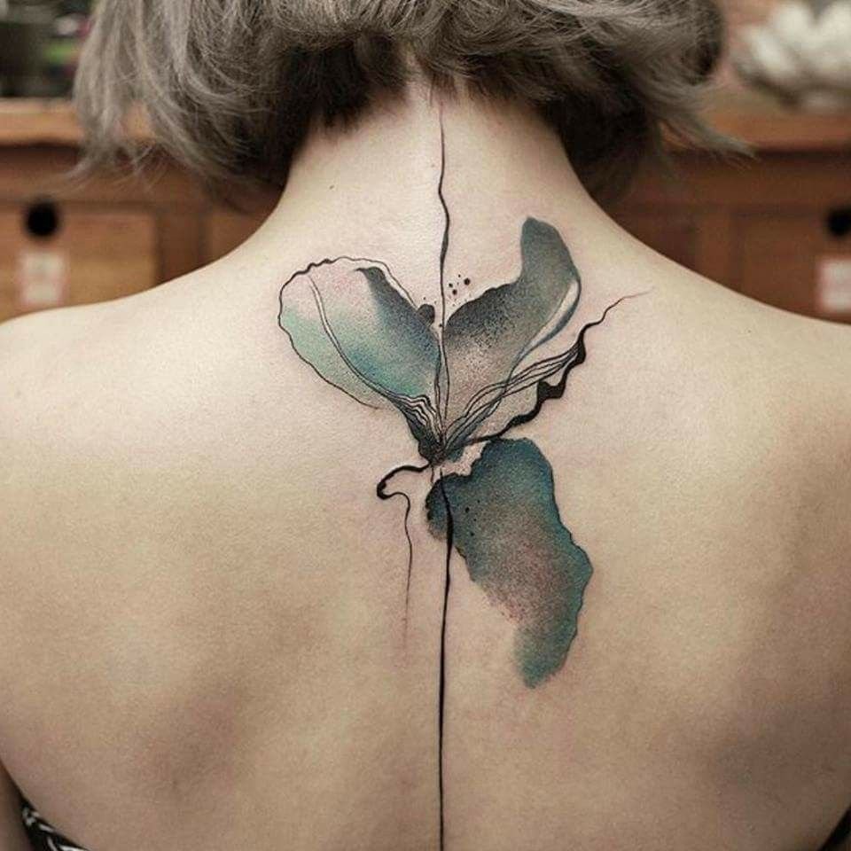 Flower tattoo on the back for women