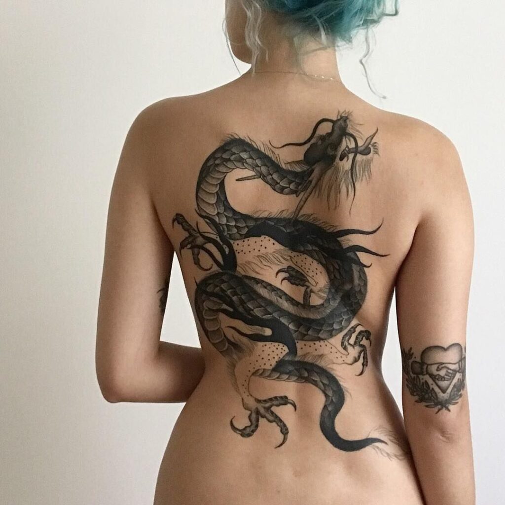 Dragon tattoo on the back for women