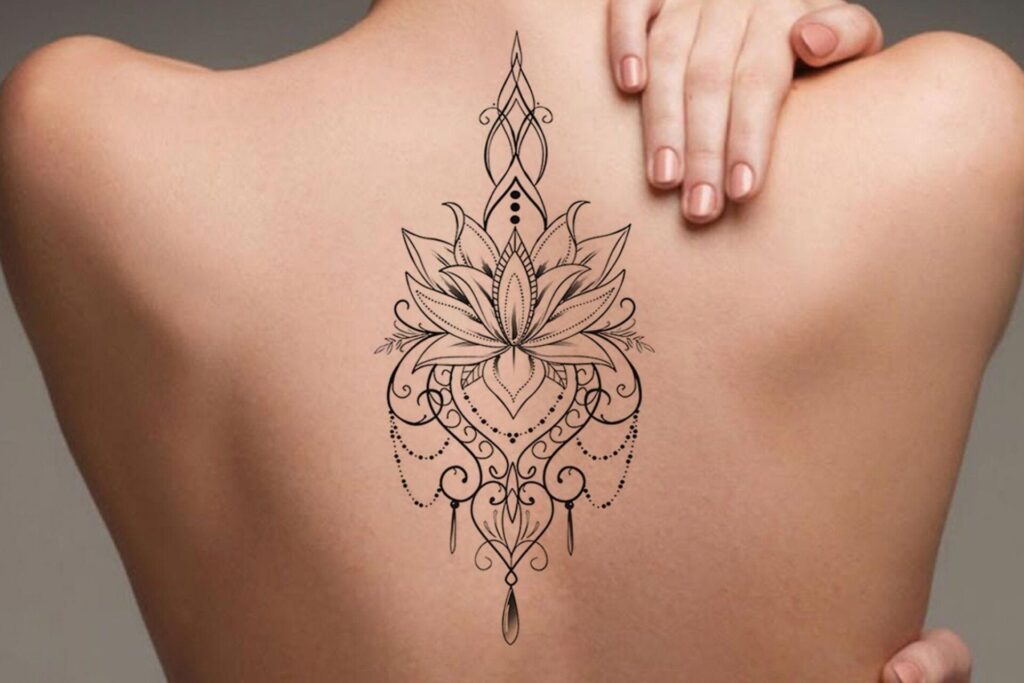 Lotus tattoo on the back for women