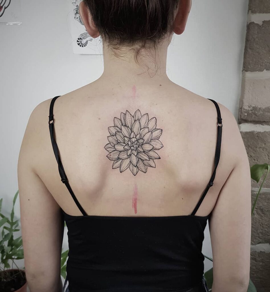 Flower tattoo on the back for women