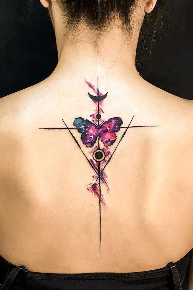 Colored butterfly tattoo on the back for women