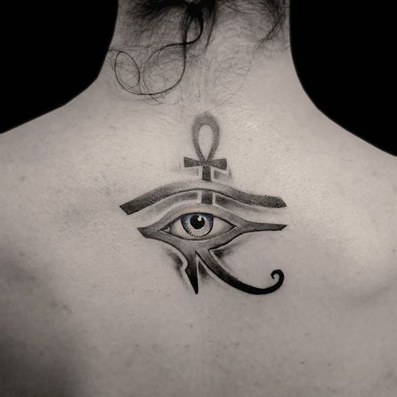 Eye tattoo on the back for women