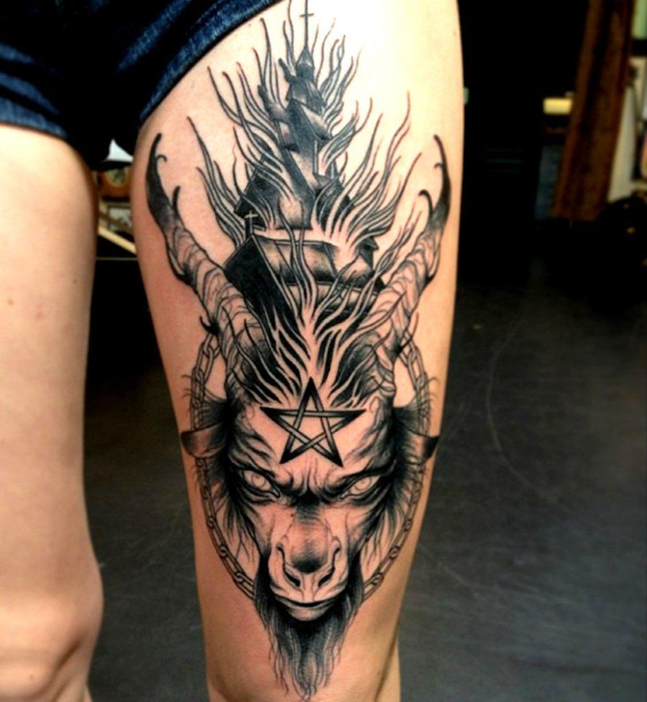 Large tattoo on the thigh for men