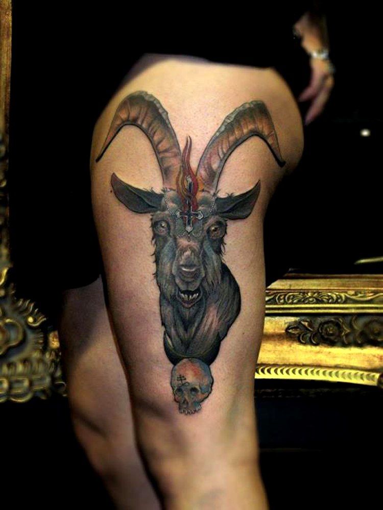 Tattoo of a goat on the hip for men