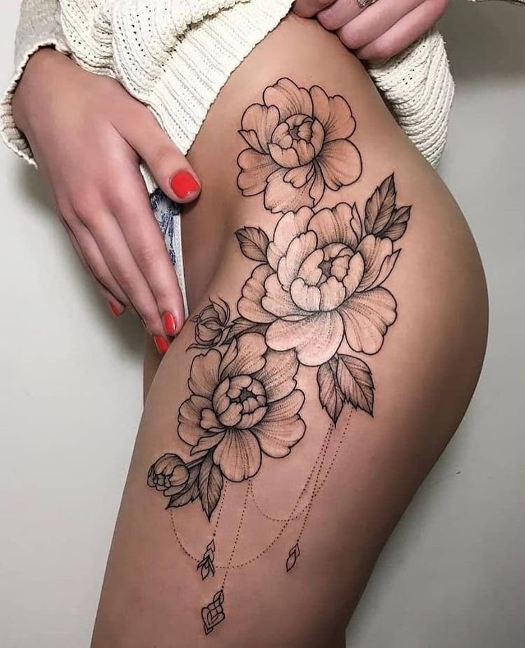 Large peony tattoo on the thigh for women