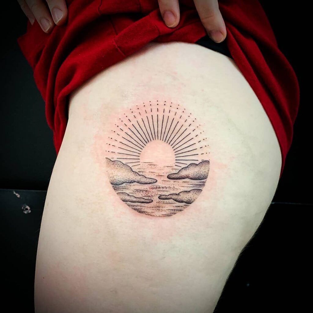 Sun tattoo on the hip for women