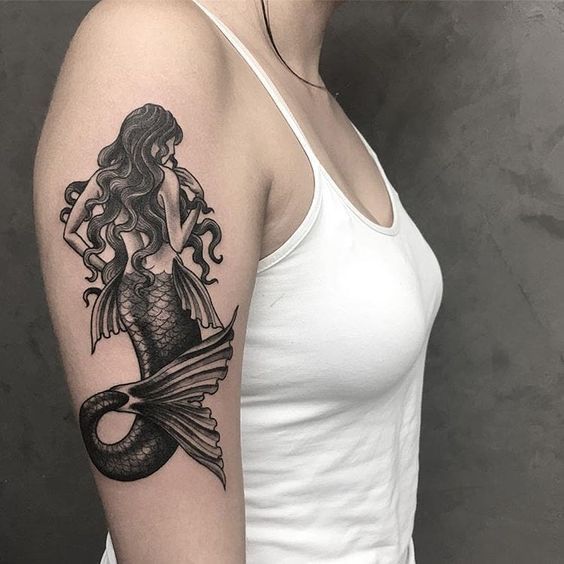 Large mermaid tattoo on the shoulder for women