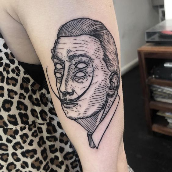 Large Salvador Dali tattoo on the shoulder for women