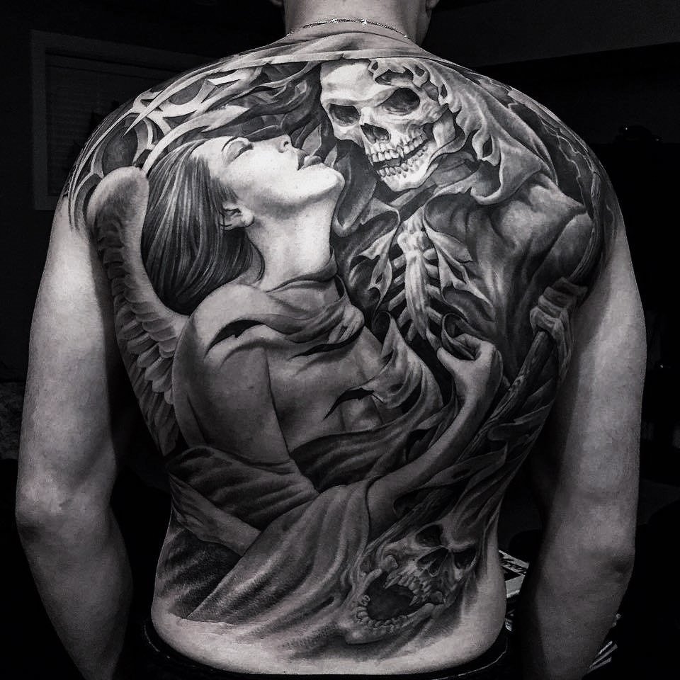 Tattoo of a girl with a black&grey skull on her back for men