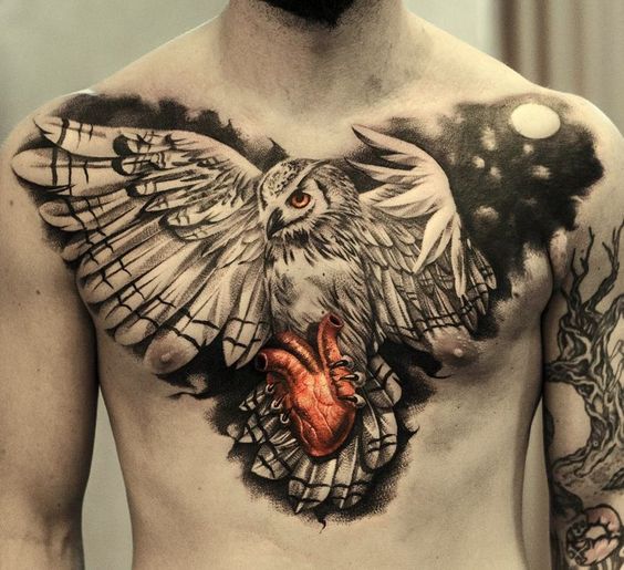 Large owl and heart tattoo on the chest for men