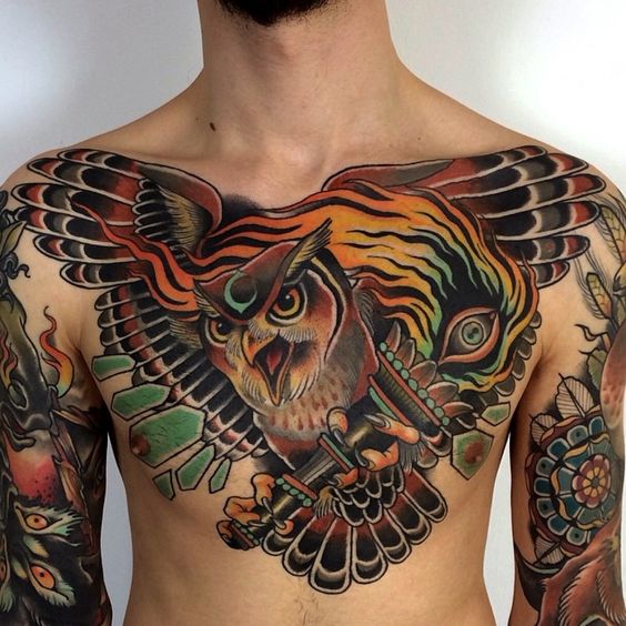 Colorful owl tattoo on the chest for men