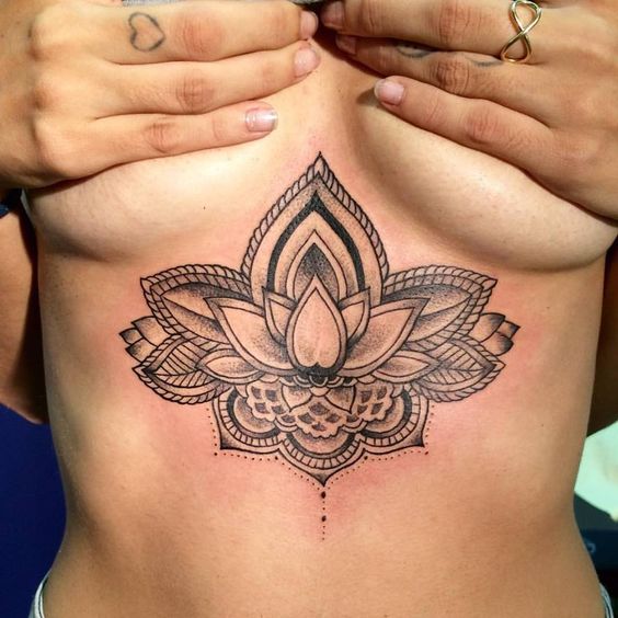 Large lotus tattoo on the chest for women