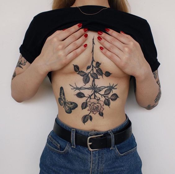 Rose tattoo on the chest for women